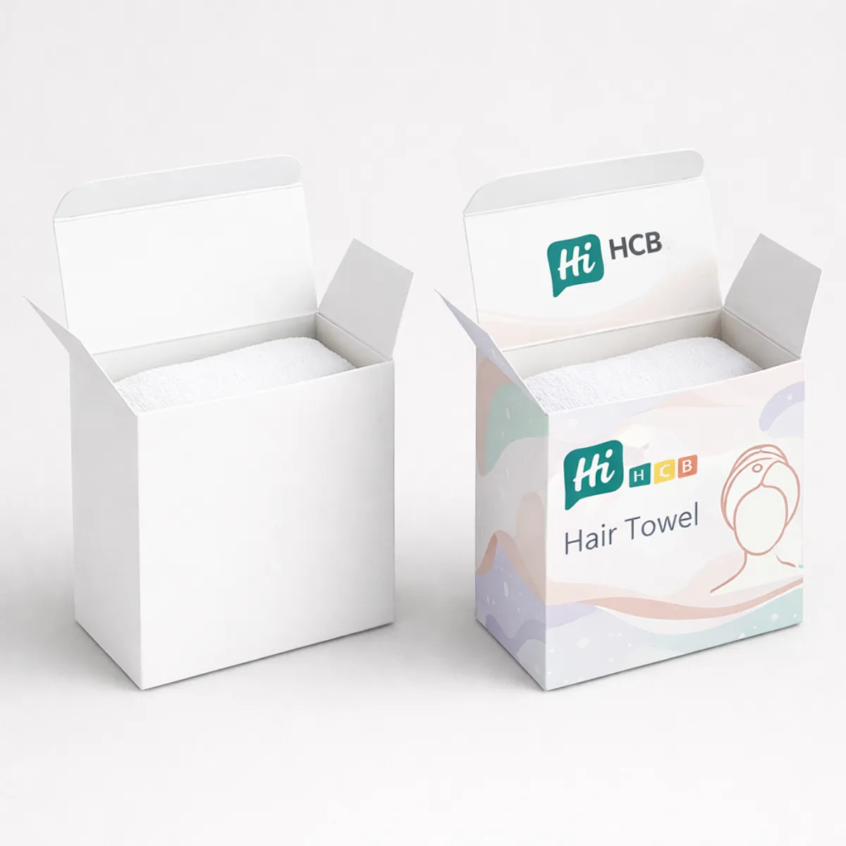 Two white square boxes- one plain and one with pastel waves and a hair towel logo- class=